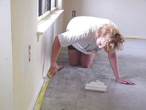 Painting baseboard molding with carpet protection