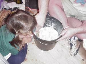 Mixing grout with a helper
